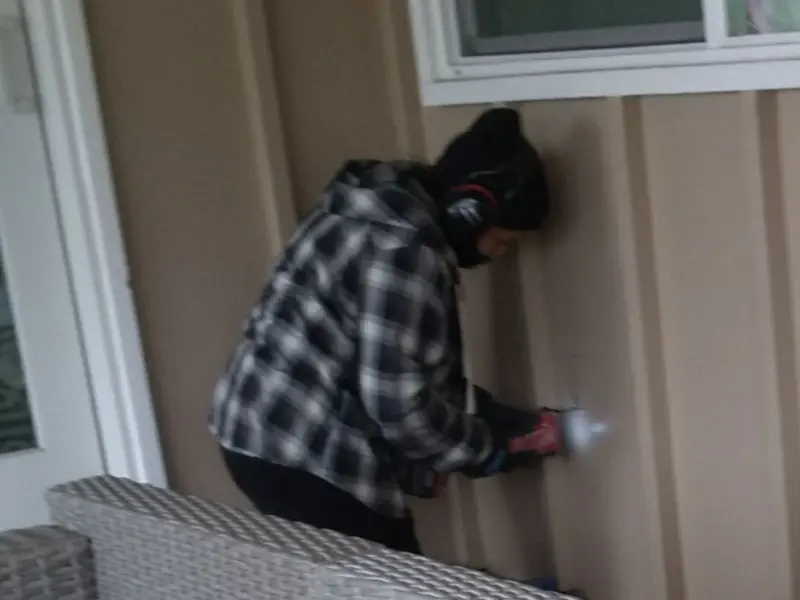 Professional electrician installing an exterior outlet in Bound Brook